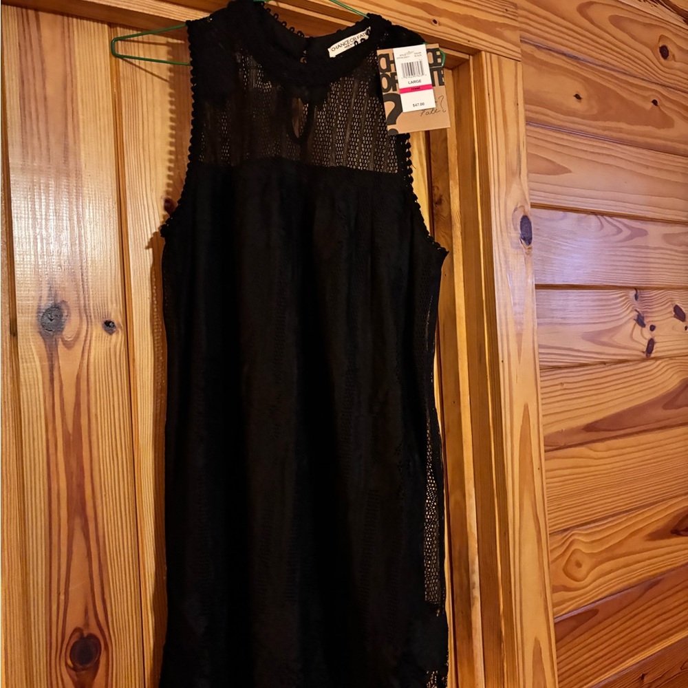 Black cocktail dress never worn with tags on it.  Very elegant
